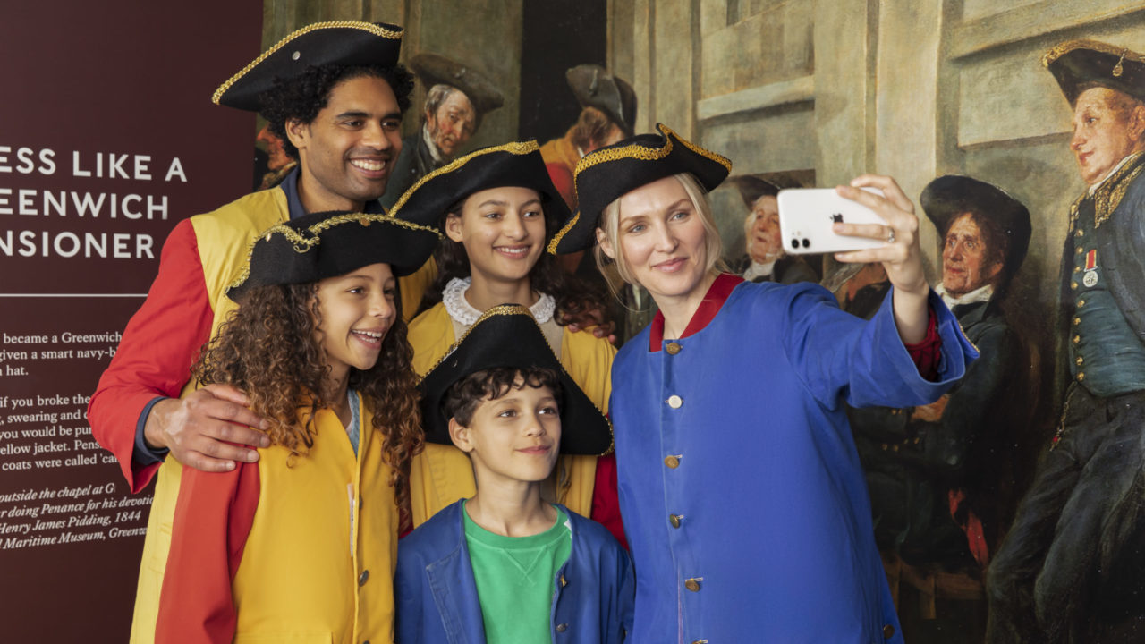 Family in visitor centre taking selfie