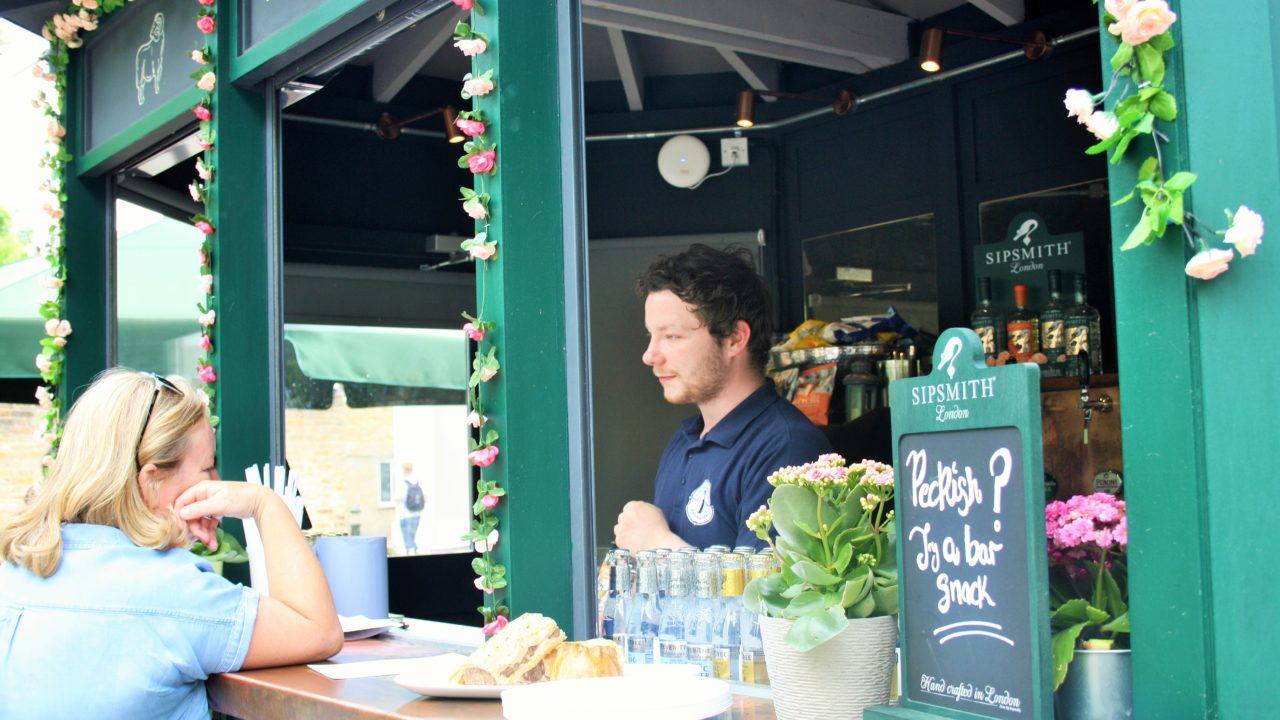 Customer being served at The Old Brewery outdoor bar